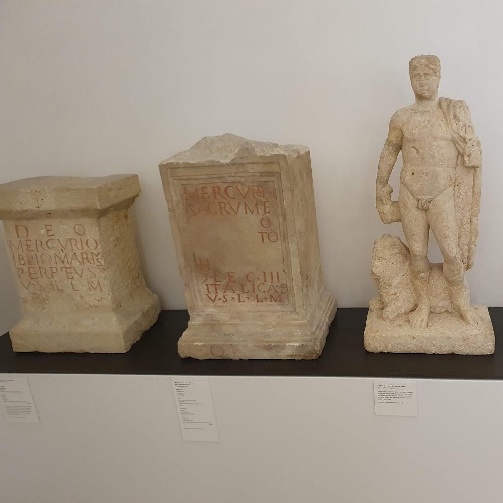 Three Roman stone sculptures, one of a man with a lion.